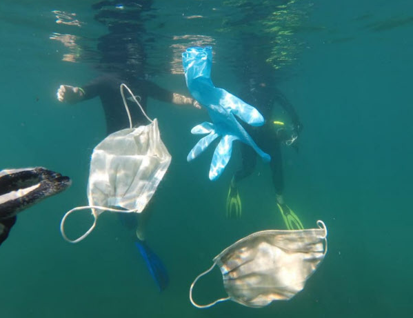 Corona pollutes the sea Abandoned mask, floating like jellyfish